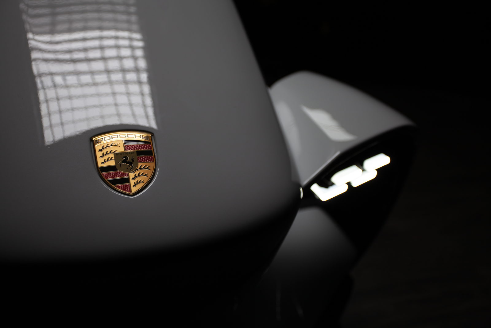 Porsche Crest on the front wing